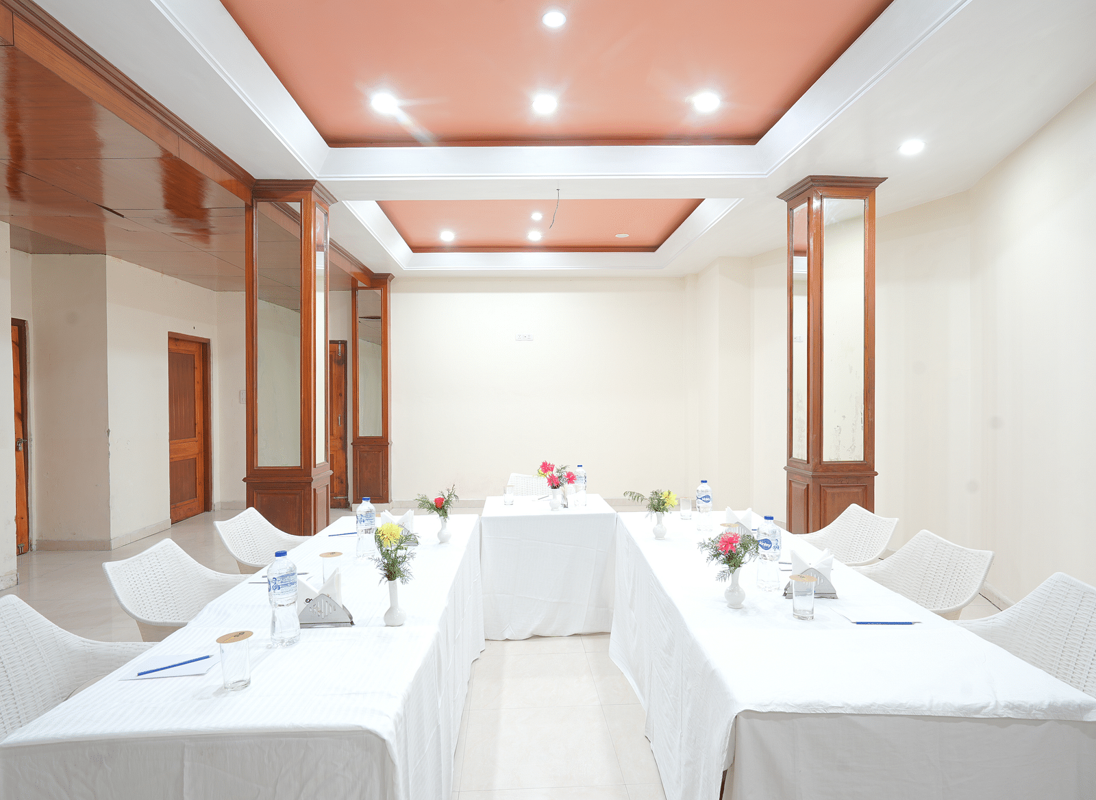 Conference hall with chairs and tables neatly arranged at DLS Hotels The Rock Castle.